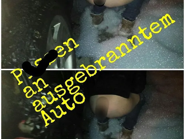 neben ausgebrantem Auto gepisst