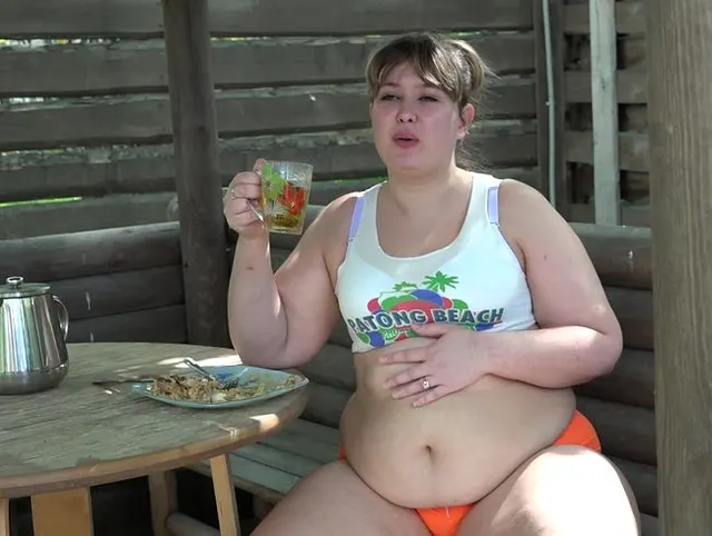 I eat a lot of the street, drinking tea and show huge belly